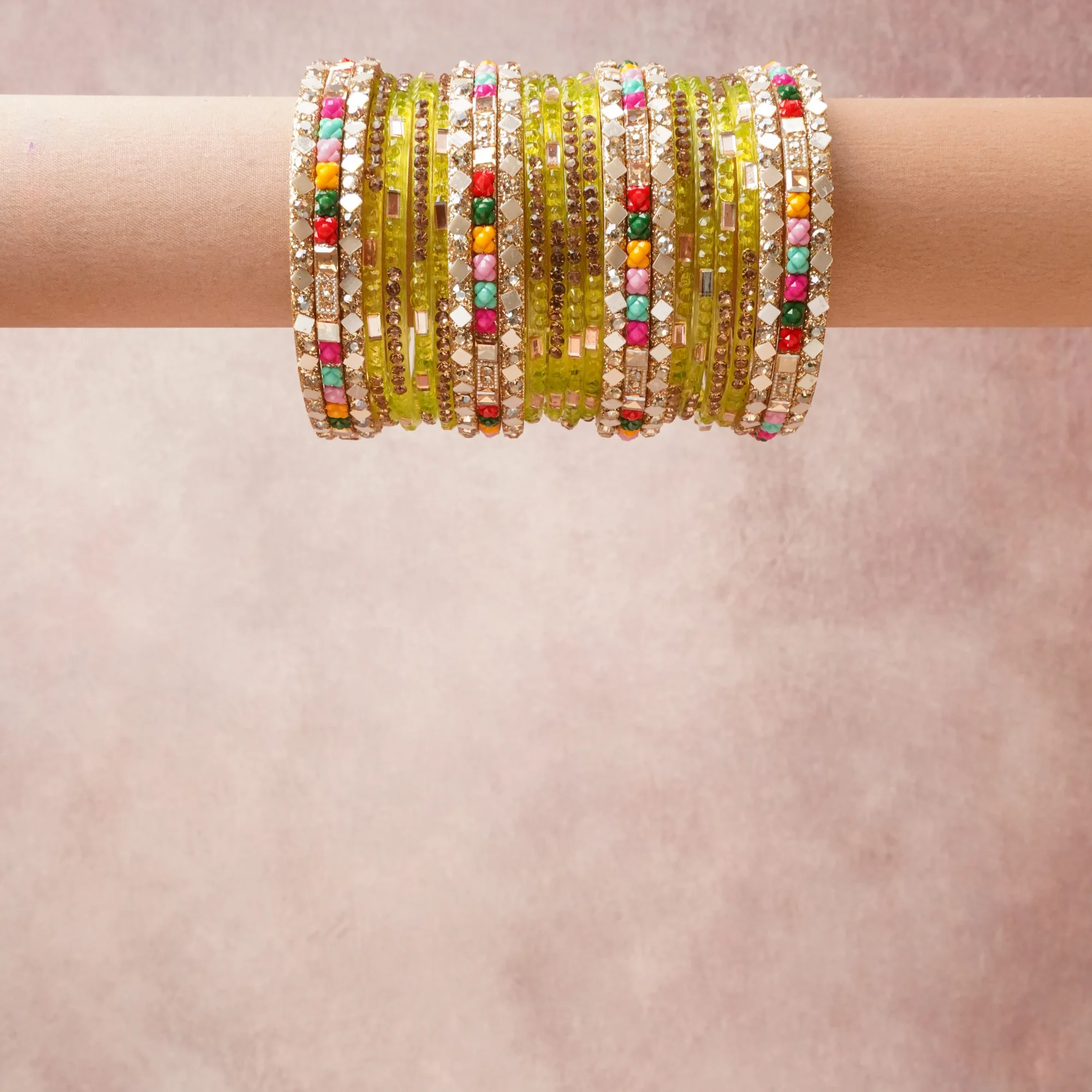 A grounding Amber Gold forms the heart of the set, while touches of Vermilion, Tangerine, Fuchsia, Teal, Forest Green, Reflective Silver add charm.

A thoughtful composition of Glass, Base Metal, Mirror, Rhinestones, designed to feel complete without being heavy.
Each element layers seamlessly, creating a look that is refined, wearable and quietly striking.